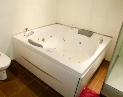 Foto del jacuzzi en la Suite Deluxe con bañera de hidromasaje.