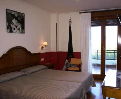 Una de las acogedoras habitaciones con balcón de este hotel boutique.