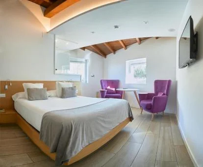 Una de las coquetas habitaciones dobles y acogedor estilo de este hotel boutique.