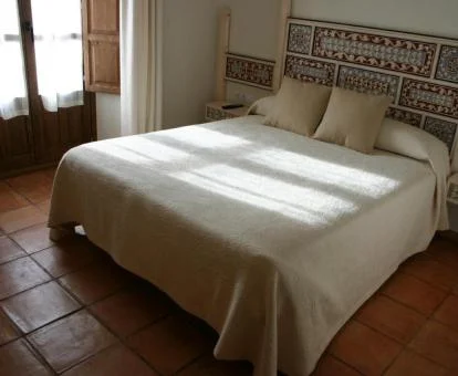 Una de las acogedoras habitaciones de estilo tradicional de este hotel rural.