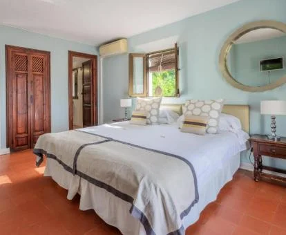 Una de las acogedoras habitaciones de estilo tradicional de este hotel boutique.
